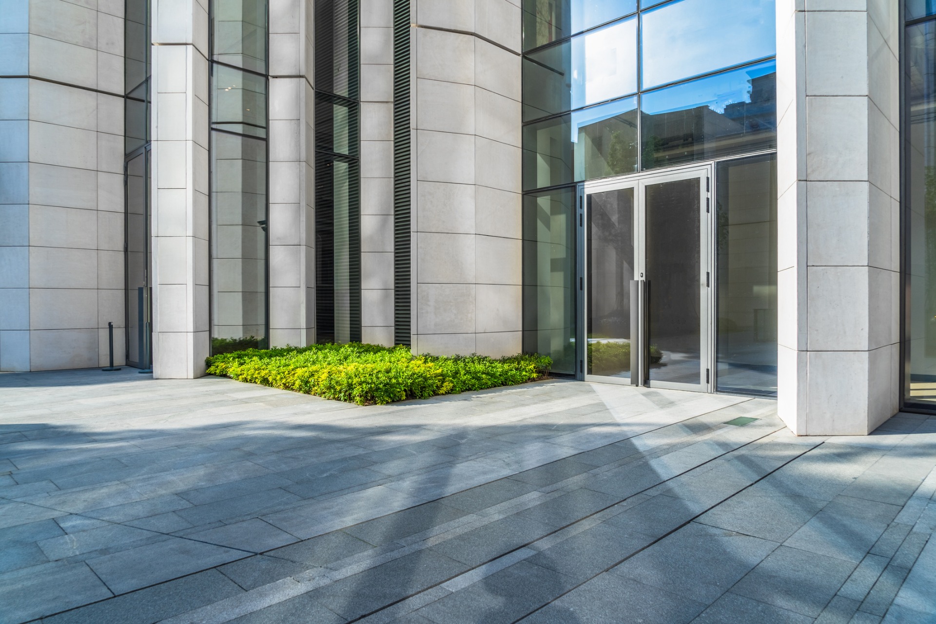 Double glass doors installed on corporate building with glass windows for walls
